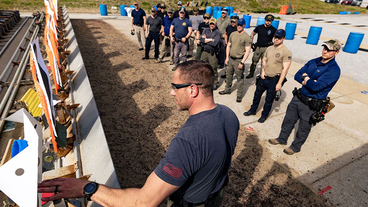 students listening to instructor in behavior based combative handgun course